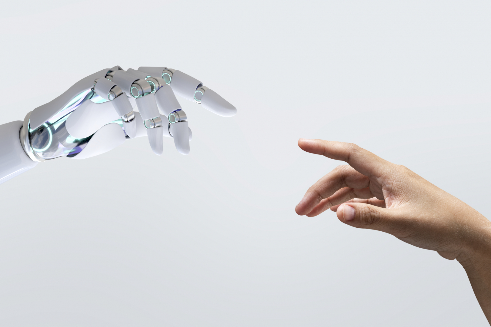 mano humana y mano artificial señalándose